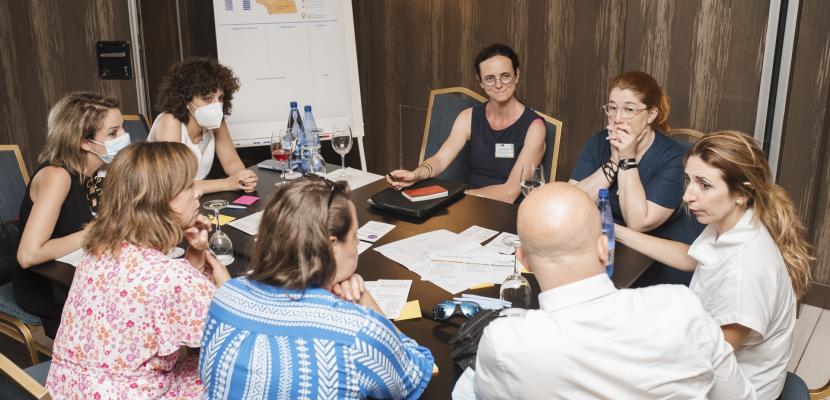 People around a table and working together