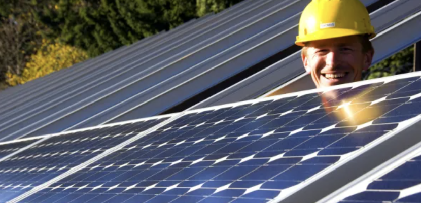 Construction worker and solar panels