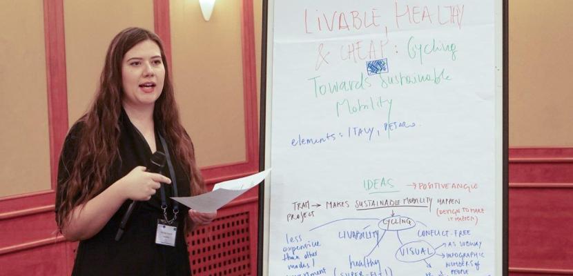 Woman showing something on a board