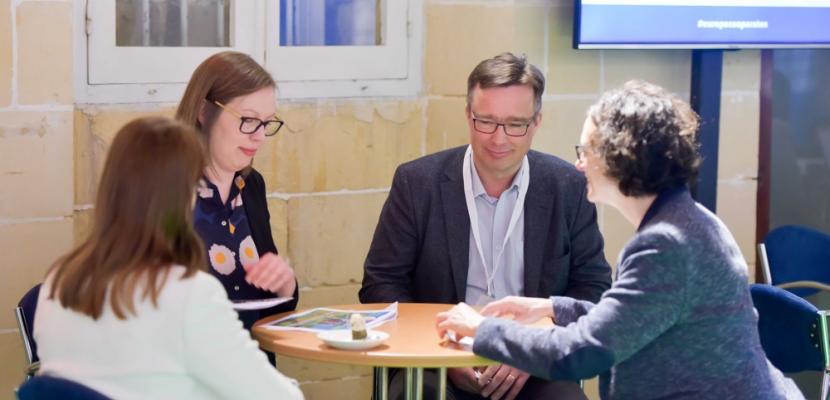 People network around a table at Project partner event - 2017