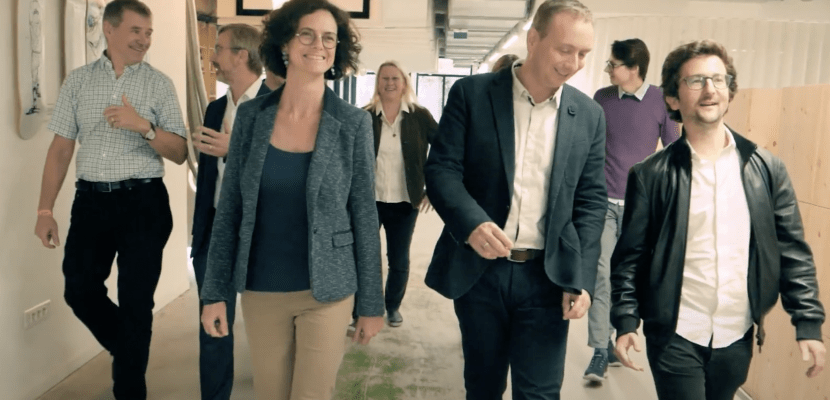 People walking through hallway People walking through hallway