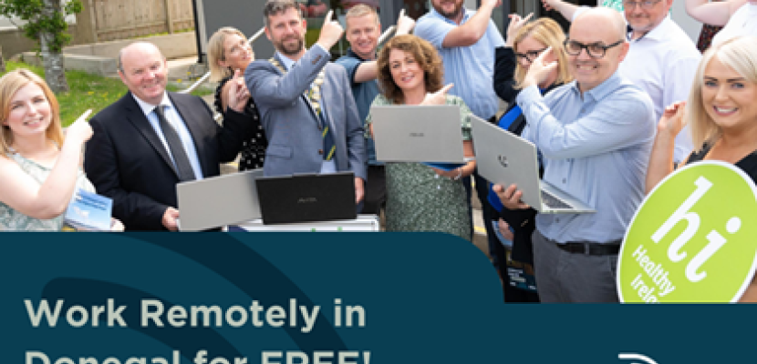 Group of people promoting the "Work Remotely in Donegal for FREE!" outside a remote working hub.