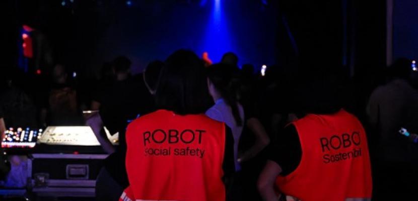 Sustainability team at work during the festival wearing identification vests