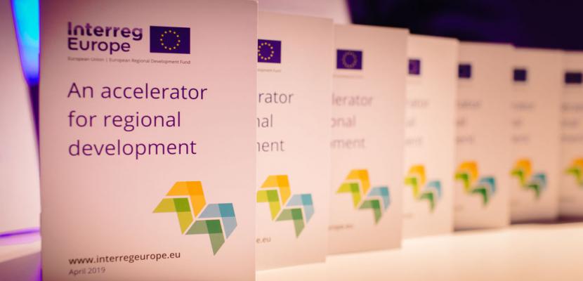 Series of Interreg Europe brochures on table