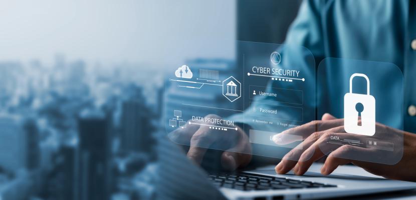 you can see a computer and its keyboard with hands typing on it: and the word cybersecurity written with a locker and a key .