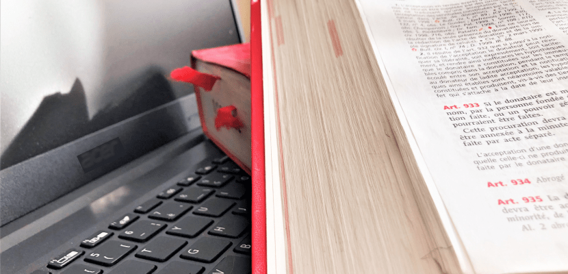 legal books put on a the keyboard of a laptop