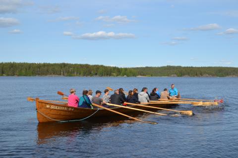 People rowing boats