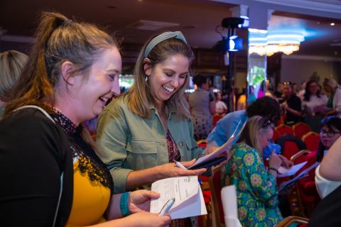 Women in business networking, laughing, having fun 