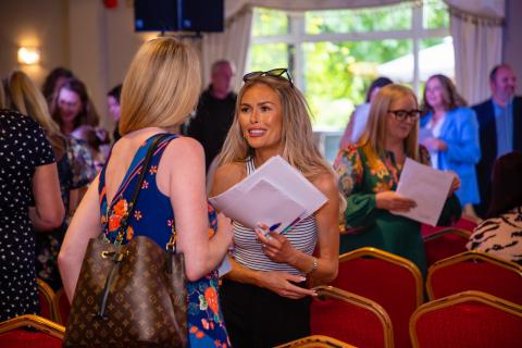 Women in business networking, laughing, having fun 