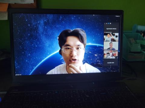 A screenshot of a Zoom meeting showing a presenter speaking with a virtual background of Earth from space. The participant panel on the right shows attendees including Agnieszka Nedza, Heesung Woo, Matías Mattamala, Philippe Giguère, and Janelle Hale.