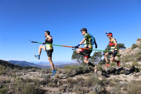 Volunteers with visually impaired person hiking in natural protected areas