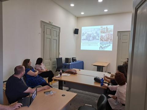 People in workshop meeting looking at presentation