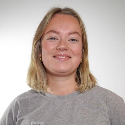 Woman's professional headshot in front of a white background 