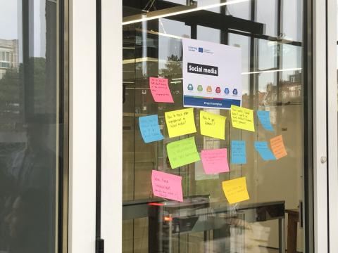 Sticky notes on a window during a brainstorming session