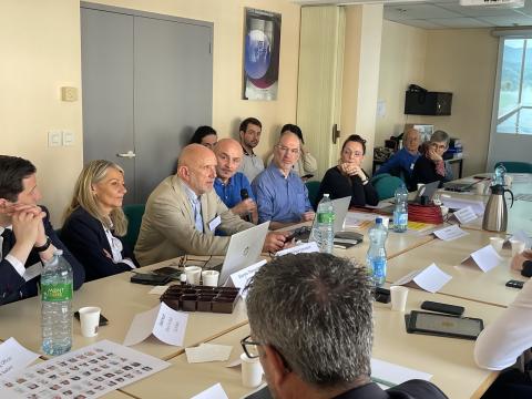 People around a meeting table having a conference