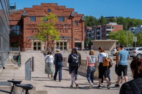 People walking towards building