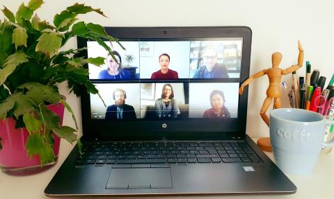 Online meeting with project partners Online meeting on a laptop