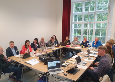 Group of people in workshop meeting