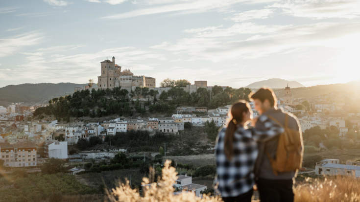 A young couple contemplating the landscape of Caravaca de la Cruz, Murcia.