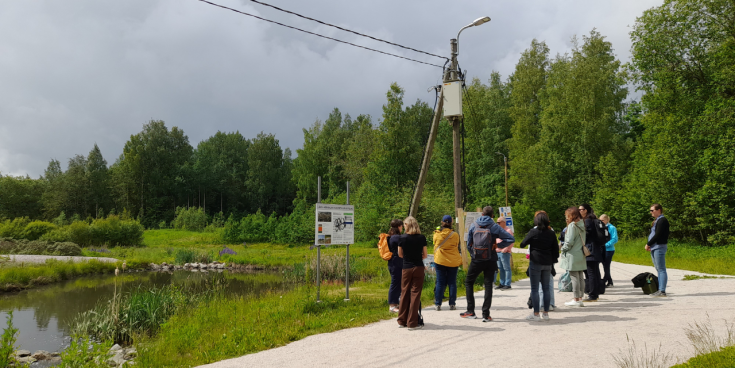 A group of people standing in front of stormwater management site