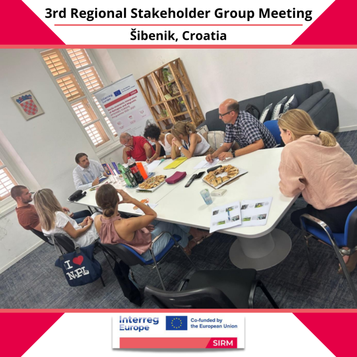 People sitting at a table during a meeting.