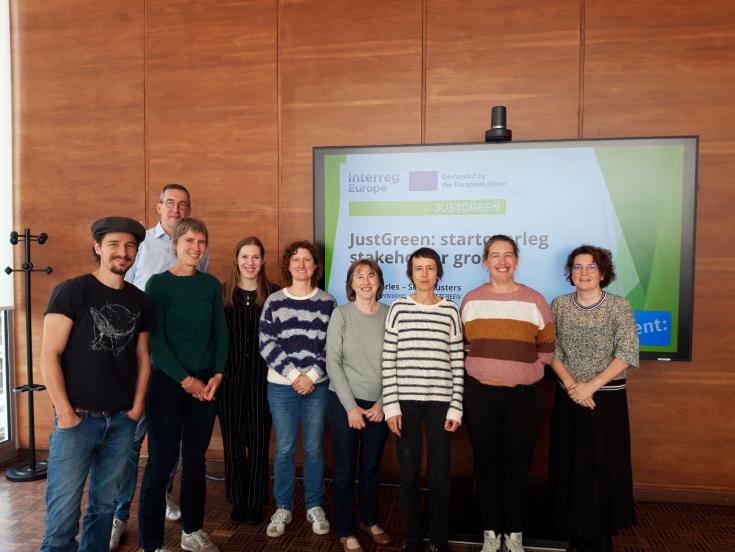 Group of people in front of JUSTGREEN EU Interreg screen