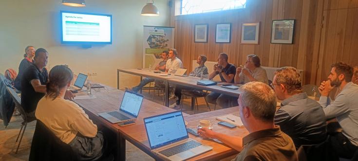 People sitting at the table in a stakeholder meeting