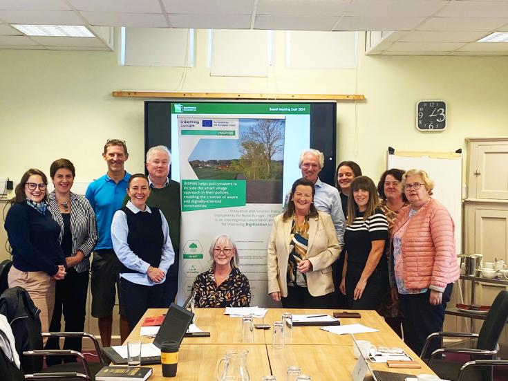 INSPIRE Ballyhoura Development Regional Stakeholder Meeting with Coote Hall, Kilmallock, Co. Limerick, posing for a photo in front of the INSPIRE Roll Up Banner