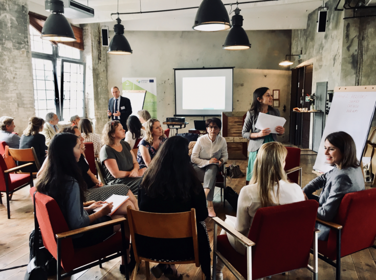 People sitting and listening to presentation