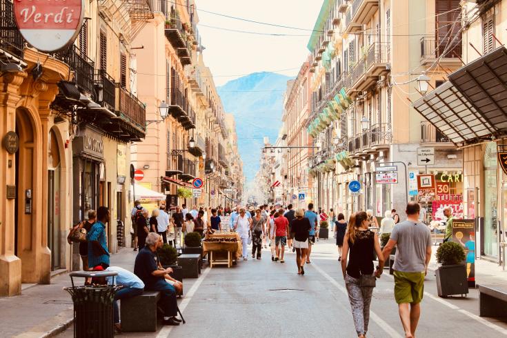 People walking through shopping street