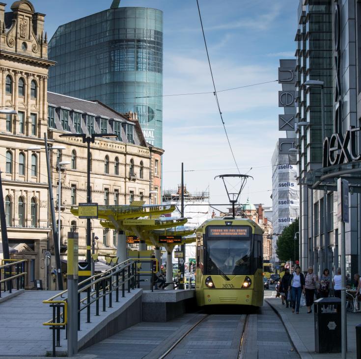 Electric tram in a city centre