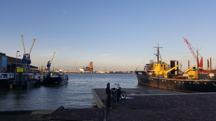 Shipyard with cranes in the background