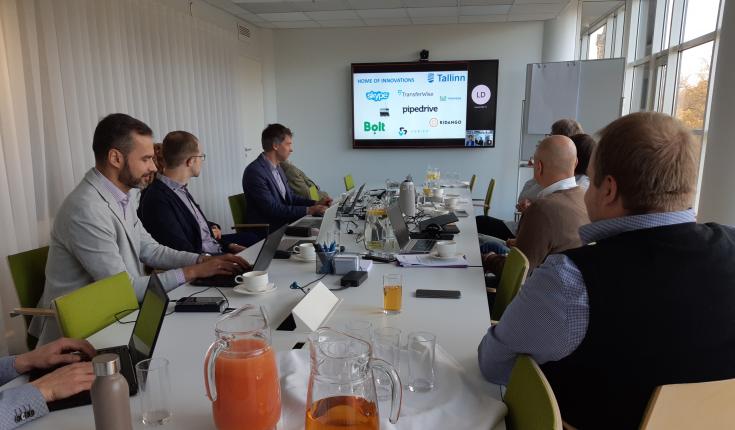 Tallinn peer review participants listening to a presentation