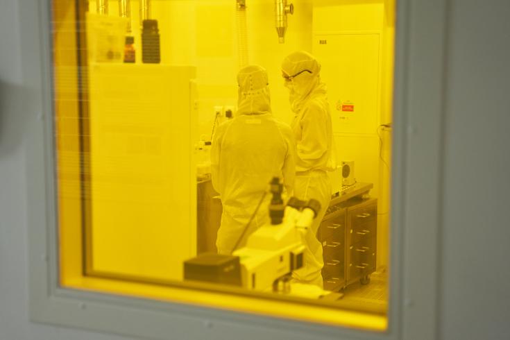 Two people standing in a lab