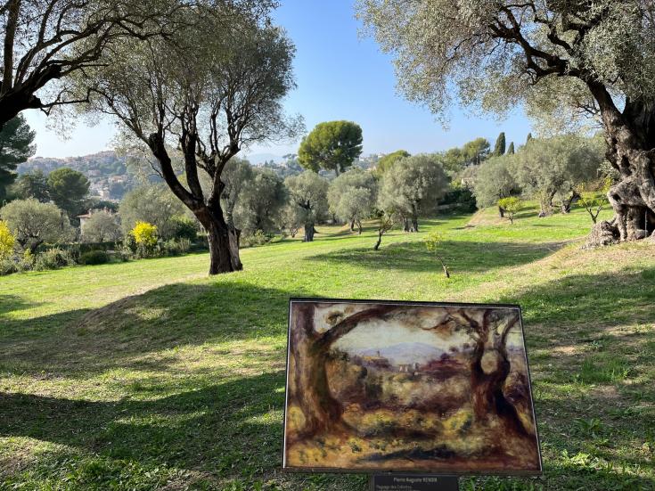 Lush green landscape with a painting of the landscape