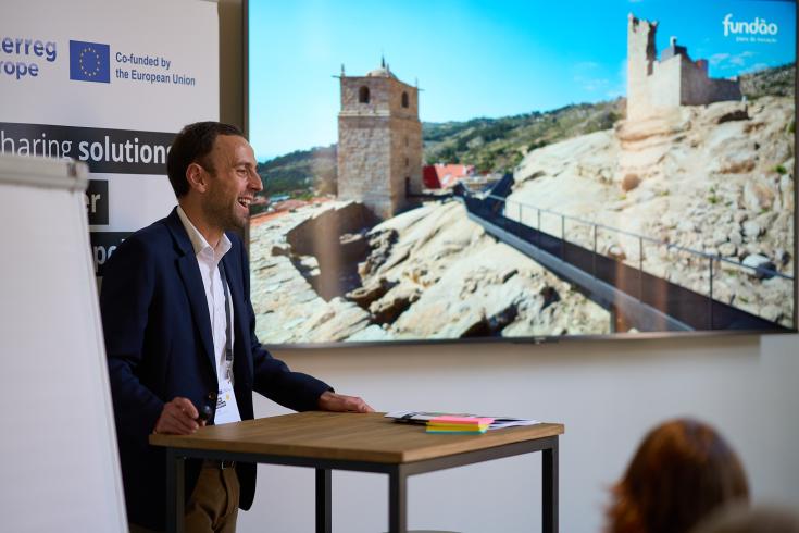 Man standing giving a presentation