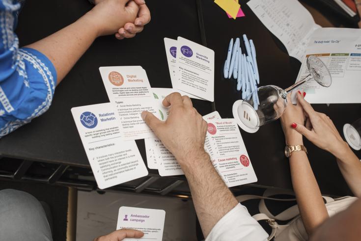 a hand handling cards