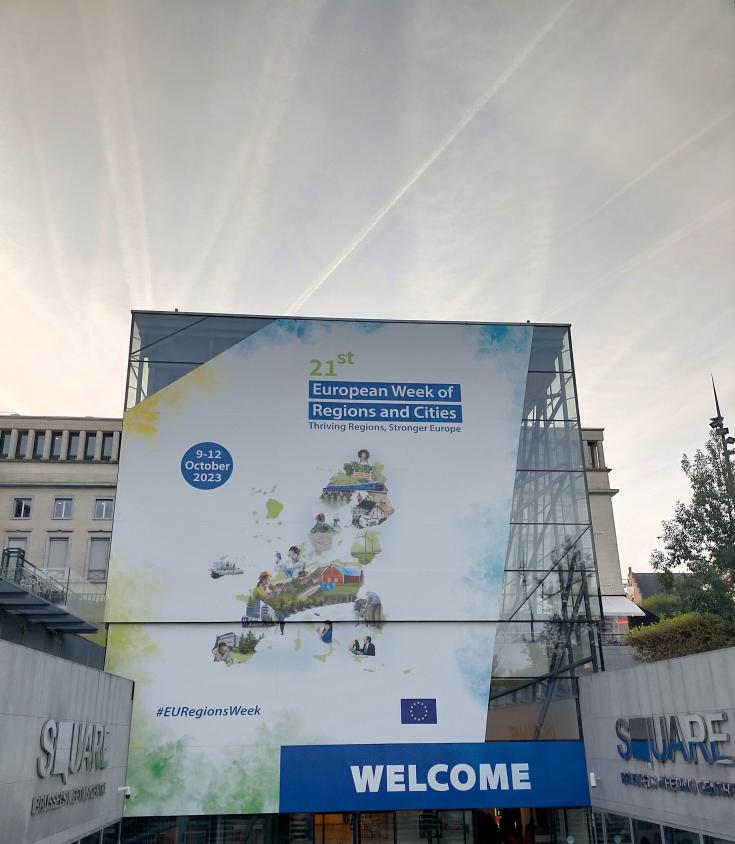 A large sign welcomes attendees to EU Week