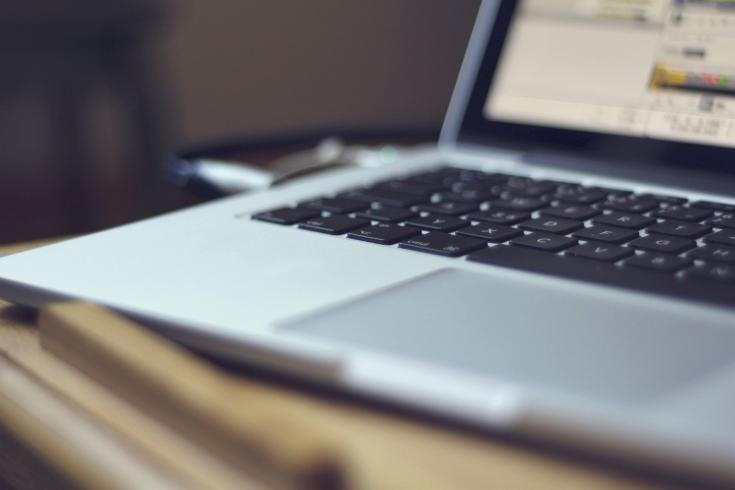 A laptop on a desk.