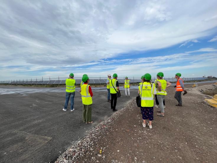 People visiting a gypsum landfill  redeveloped into a solar park
