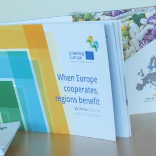 Our publication 'When Europe cooperates, regions benefit' Publication entitled 'When Europe cooperates, regions benefit' placed upon a table with hashtag Europe cooperates behind it