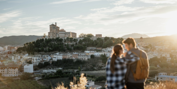 A young couple contemplating the landscape of Caravaca de la Cruz, Murcia.