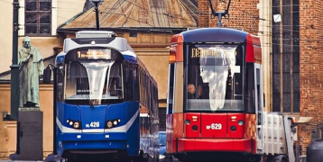 Two trams on a street in Krakow