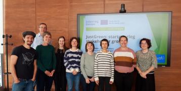 Group of people in front of JUSTGREEN EU Interreg screen