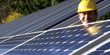 Construction worker and solar panels