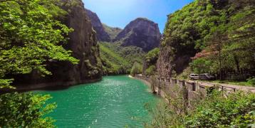 The aquamarine river Furlo and the lush, light green vegetation around the canyon.
