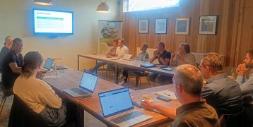 People sitting at the table in a stakeholder meeting