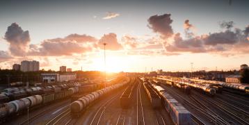 an image of trains and a sunset representing local identity in transitioning times