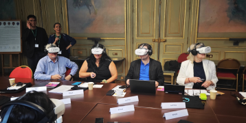 People experimenting virtual reality in conference room 