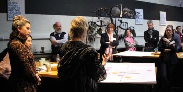 People listening to woman presenting People listening to woman presenting